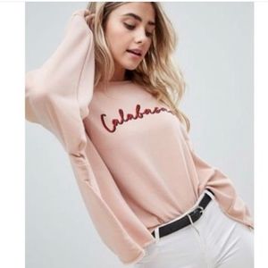 Missguided blush ‘Calabasas’ oversized sweatshirt